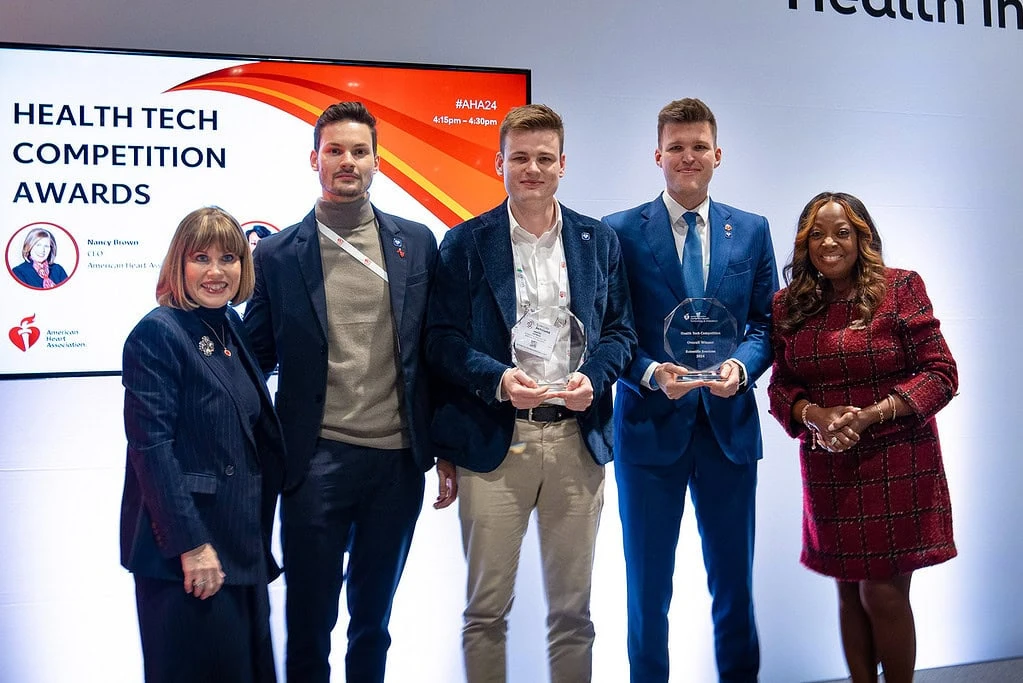 Powerful Medical founders receiving Best Science Startup and Overall Winner trophies at AHA 2024 Health Tech Competition