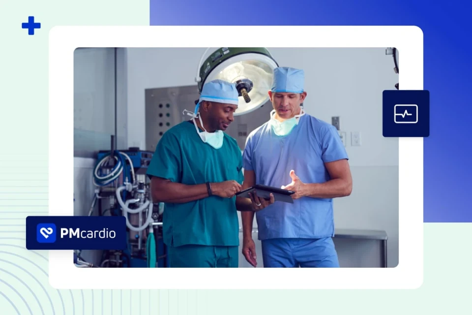 Two surgeons in scrubs reviewing a tablet in an operating theatre with PMcardio branding