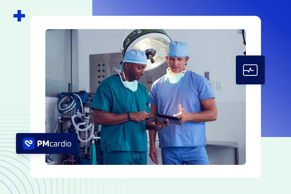 Two surgeons in scrubs reviewing a tablet in an operating theatre with PMcardio branding