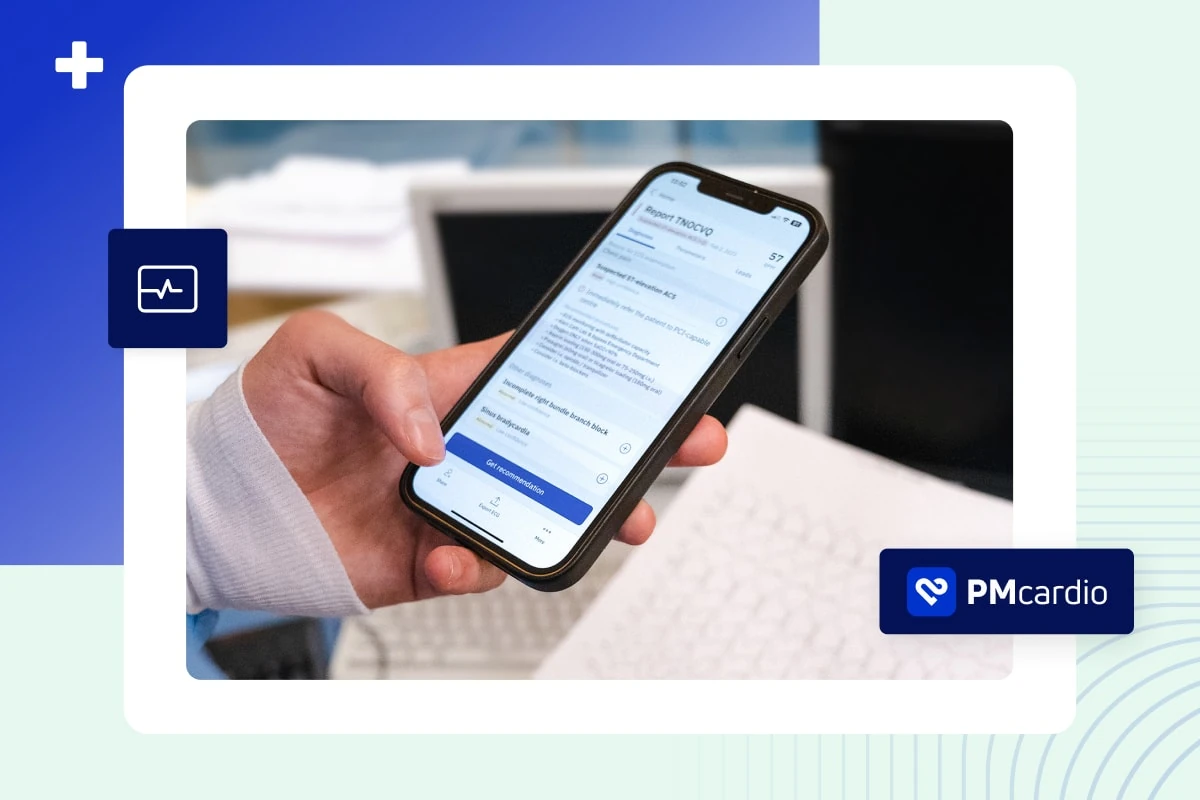 Hand holding a phone showing a PMcardio ECG report flagging suspected ST-elevation ACS