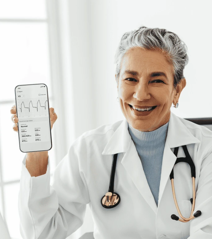 Smiling clinician in white coat with stethoscope holding a smartphone showing a PMcardio ECG report