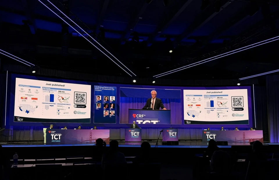 Dr. Timothy D. Henry presents Queen of Hearts STEMI study as late-breaking science at TCT 2025, results on stage screens