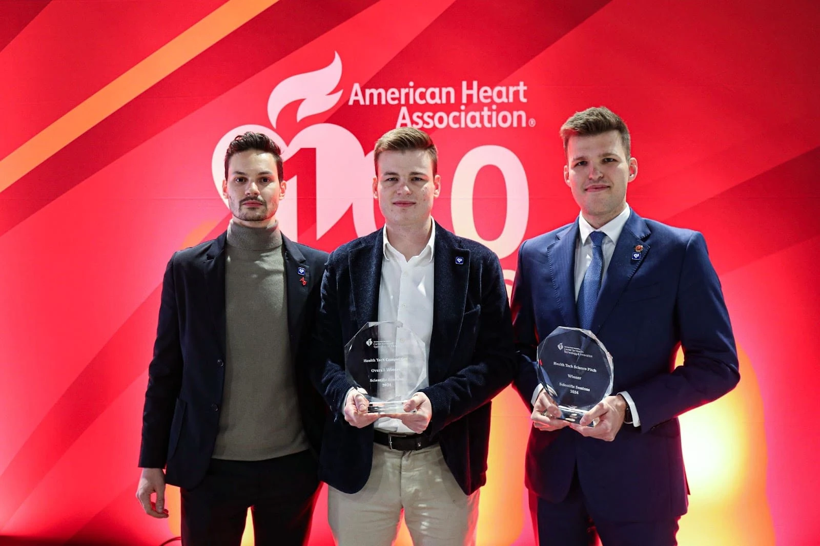 Felix Bauer, Martin Herman and Robert Herman holding AHA Health Tech Competition 2024 awards