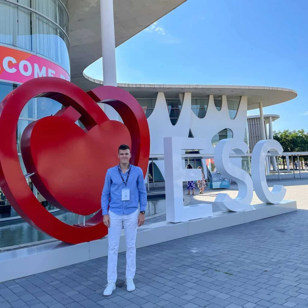 Powerful Medical representative at the European Society of Cardiology Congress in Barcelona by the red ESC heart sign