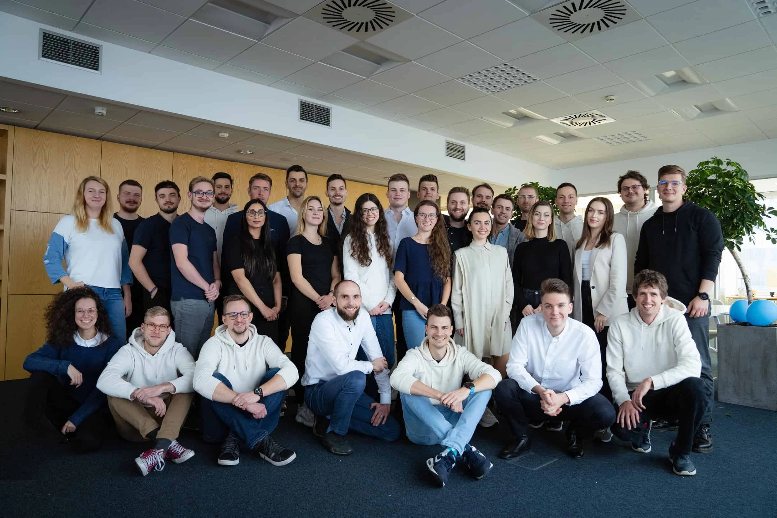 Powerful Medical team group photo of employees gathered in their new Bratislava office