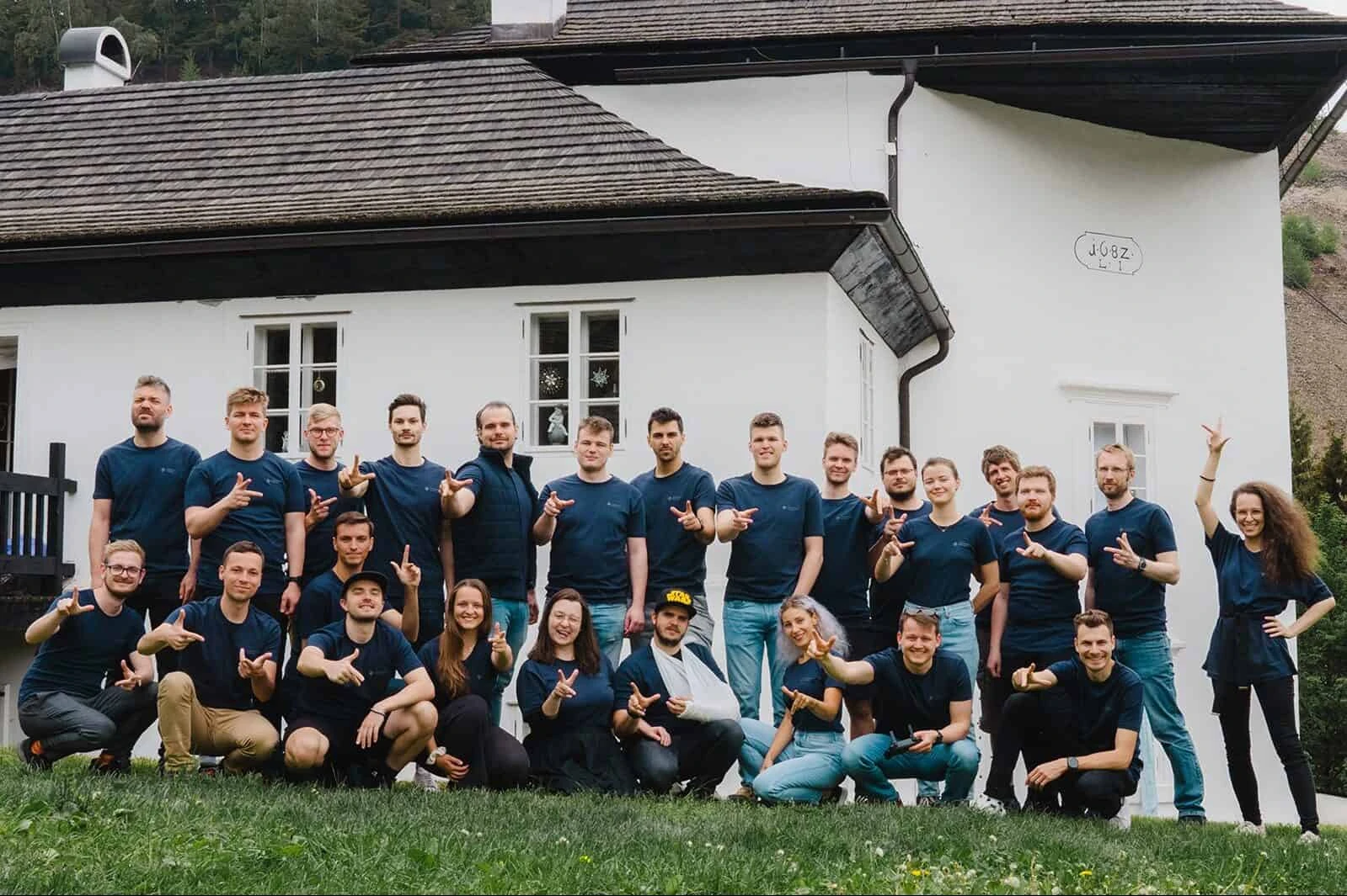 Powerful Medical team gathered outside a house at the 2022 company off-site