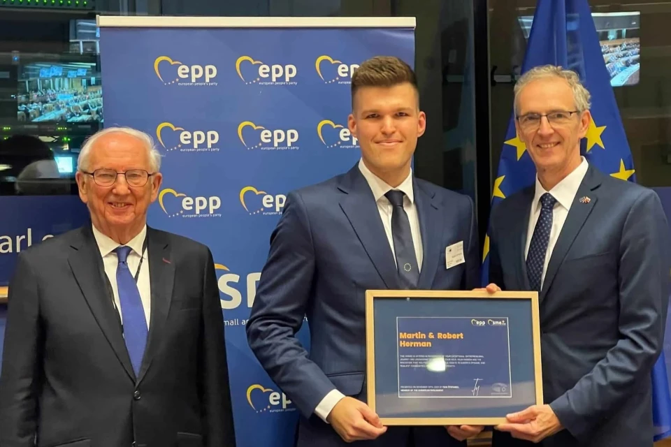 Powerful Medical team with Robert Herman holding the SME Europe Award at the European Parliament, Brussels