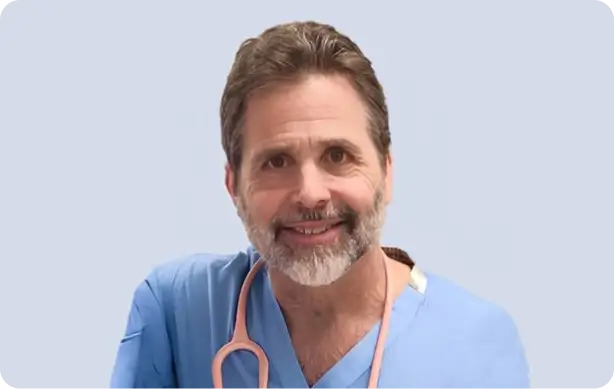 Emergency physician in scrubs with stethoscope representing expert-curated training