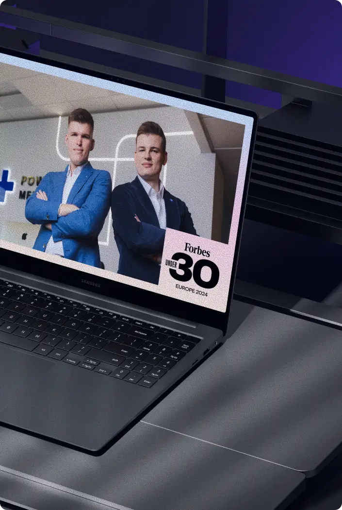 Powerful Medical founders on a laptop screen with the Forbes 30 Under 30 Europe 2024 badge